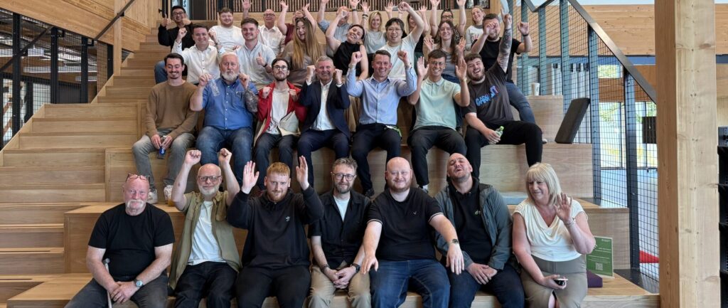 Dundee based employees of Evolt Charging gather for an office meeting.
