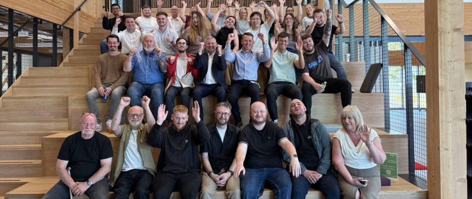 Dundee based employees of Evolt Charging gather for an office meeting.